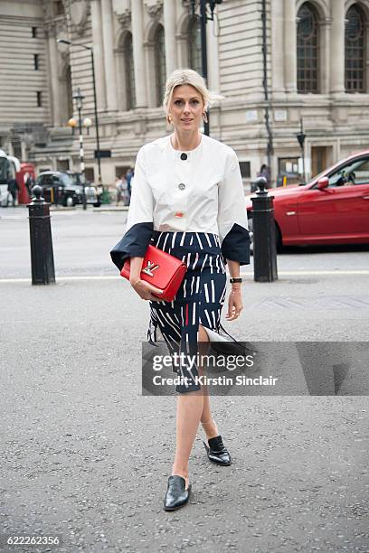 Fashion blogger Sofie Valkiers wears a Rejina Pyo top and skirt, Louis Vuitton bag and Robert Clergerie shoes day 4 of London Womens Fashion Week...