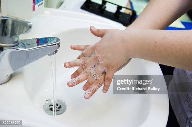 washing hands in hospital - nurse washing hands stock pictures, royalty-free photos & images