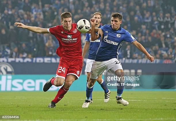 Gelsenkirchen, Germany , 1.Bundesliga 8. Spieltag, FC Schalke 04 - 1. FSV Mainz 05, v.l. Gaetan Bussmann FSV Mainz gegen Alessandro Schoepf Schalke