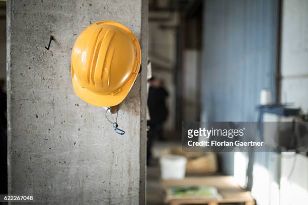 Protective helmet hangs on a column on a construction site on November 04, 2016 in Nafplion, Greece.