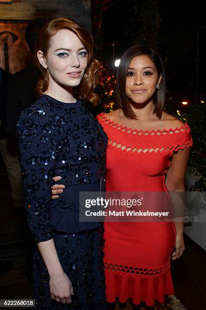 Actresses Emma Stone and Gina Rodriguez attend the Hollywood Foreign Press Association and InStyle celebrate the 2017 Golden Globe Award Season at...