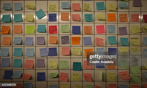 People write their messages on self-stick paper as a part of Voice Actor Matthew Chavez's public art project named "Subway Therapy" at the 6th Avenue...