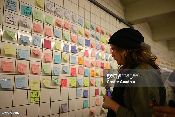 People write their messages on self-stick paper as a part of Voice Actor Matthew Chavez's public art project named "Subway Therapy" at the 6th Avenue...