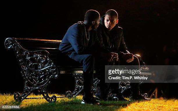 Actors Duayne Baochie and Franz Drameh on the set of 100 Streets in Wandsworth on August 25, 2014 in London, England.
