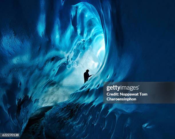 ice cave adventure in alaska - ice climbing stockfoto's en -beelden