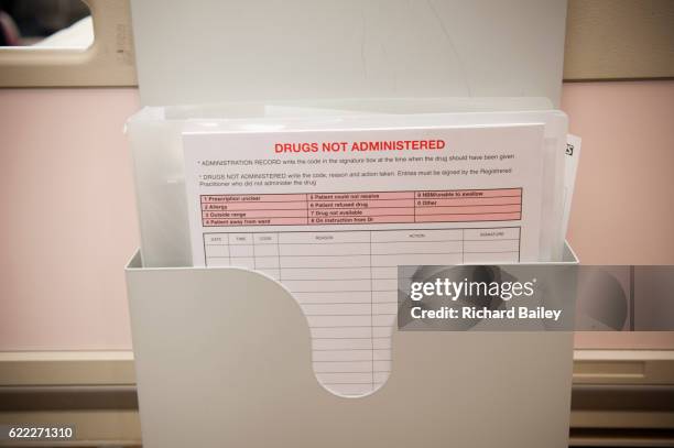 hospital patients drug chart at end of bed. - richard gentles stock pictures, royalty-free photos & images