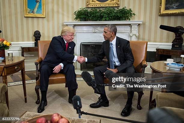 President Barack Obama shakes hands with President-elect Donald Trump in the Oval Office of the White House in Washington, Thursday, Nov. 10, 2016.