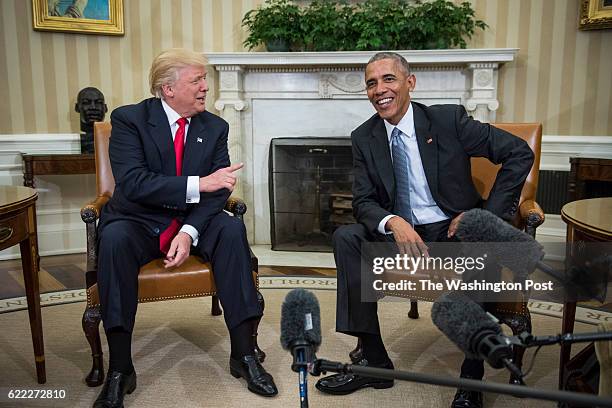 President Barack Obama shakes talks with President-elect Donald Trump in the Oval Office of the White House in Washington, Thursday, Nov. 10, 2016.