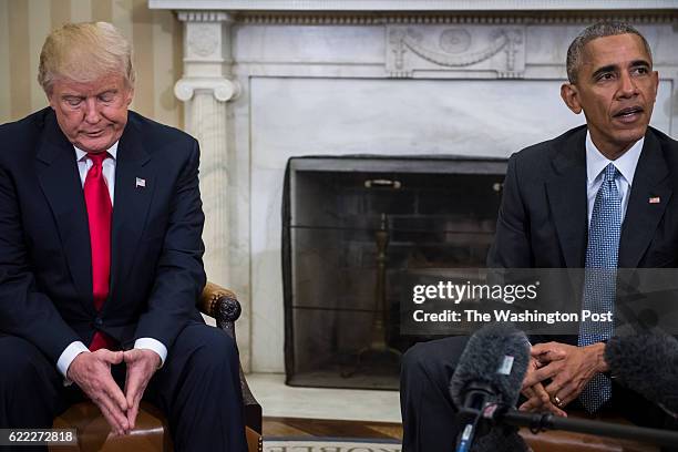 President Barack Obama and President-elect Donald Trump talk to members of the media during a meeting in the Oval Office of the White House in...