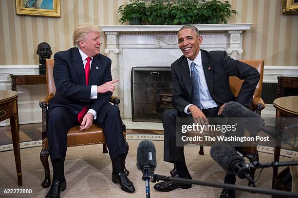 President Barack Obama and President-elect Donald Trump talk to members of the media during a meeting in the Oval Office of the White House in...