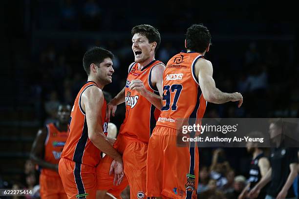 Cameron Gliddon of the Taipans celebrates with his team during the round six NBL match between the New Zealand Breakers and the Cairns Taipans at...