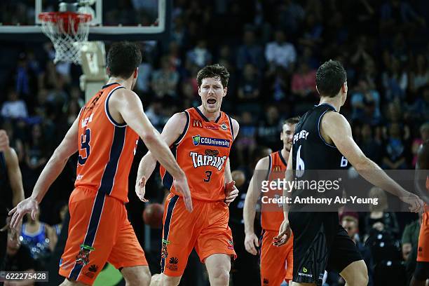 Cameron Gliddon of the Taipans celebrates with his team during the round six NBL match between the New Zealand Breakers and the Cairns Taipans at...