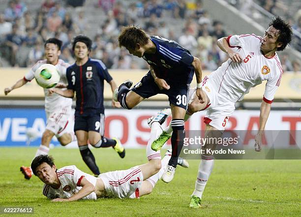 South Korea - Japan forward Yoichiro Kakitani heads home the team's second goal during the second half of an East Asian Cup soccer match against...