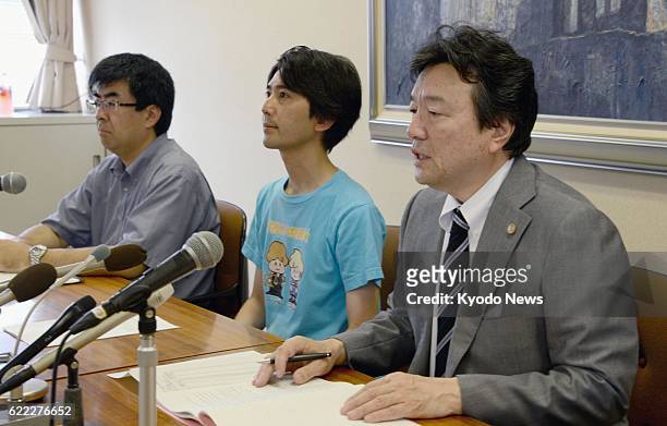 Japan - A group of lawyers hold a press conference in the city of Hiroshima on July 22 after bringing a case to the Hiroshima High Court seeking to...