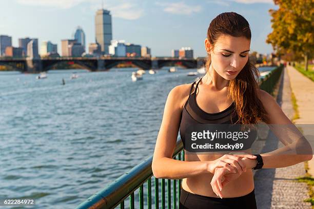 checking your activity tracker in boston, usa - spy hunter stock pictures, royalty-free photos & images