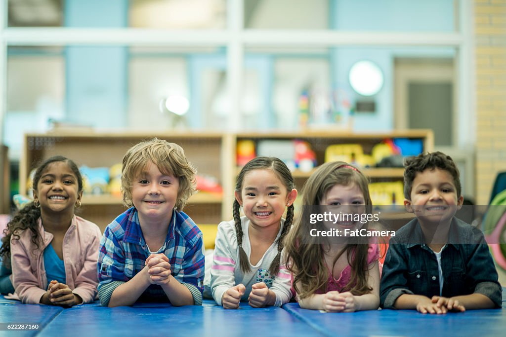 Children Lying in a Row Together