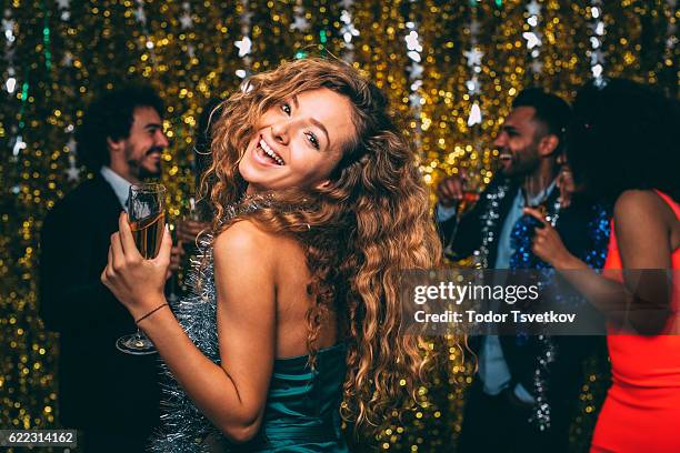 woman at a new year's eve party - happy new year 2016 stock pictures, royalty-free photos & images