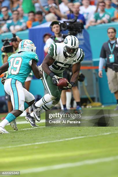 Linebacker David Harris of the New York Jets recovers a fumble against the Miami Dolphins on November 6, 2016 at Hard Rock Stadium in Miami Gardens,...