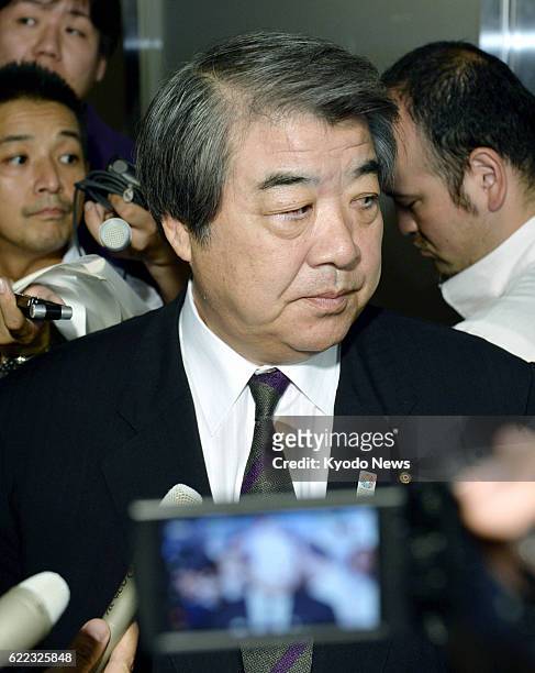 Japan - Haruki Uemura, chairman of the All Japan Judo Federation, is surrounded by reporters at the Cabinet Office in Tokyo on July 23, 2013. Uemura...