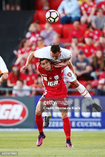 Sergio Guardiola of Adelaide United and Jade North of Brisbane Roar compete for the ball during the round six A-League match between Adelaide United...