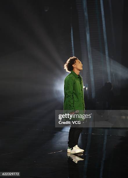 Singer Eason Chan performs on the stage during a gala of the 11.11 Global Shopping Festival at Shenzhen Universiade Sports Centre on November 10,...