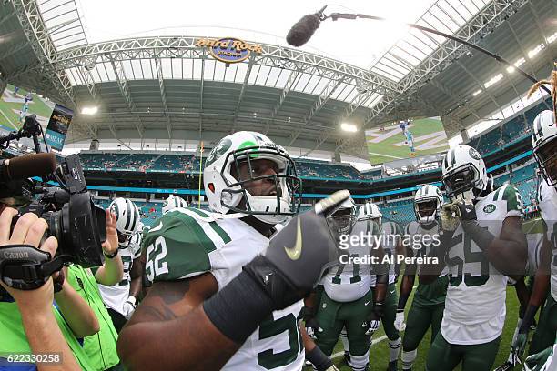 Linebacker David Harris of the New York Jets rallies his teammates against the Miami Dolphins on November 6, 2016 at Hard Rock Stadium in Miami...