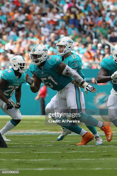 Center Mike Pouncey of the Miami Dolphins blocks against the New York Jets on November 6, 2016 at Hard Rock Stadium in Miami Gardens, Florida. The...