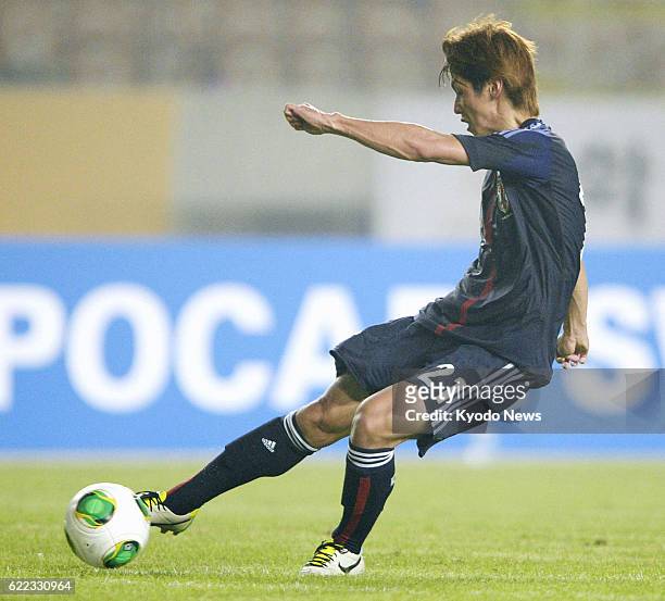 South Korea - Japan forward Yuya Osako scores his second and the team's third goal during the second half of an East Asian Cup soccer match against...