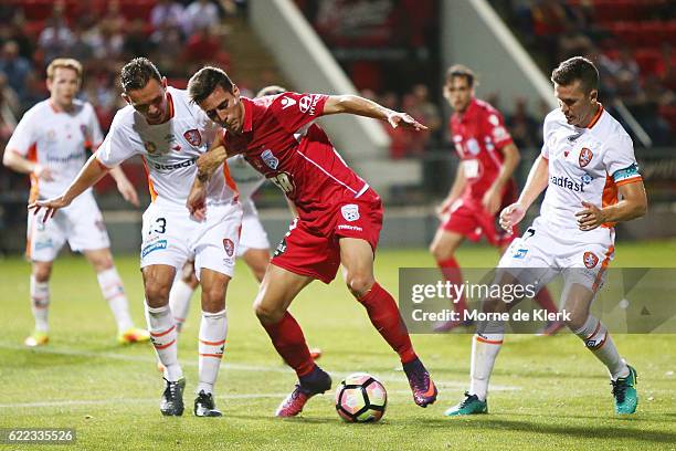 Sergio Guardiola of Adelaide United competes for the ball with Jade North of Brisbane Roar during the round six A-League match between Adelaide...