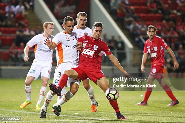 Sergio Guardiola of Adelaide United competes for the ball with Jade North of Brisbane Roar during the round six A-League match between Adelaide...