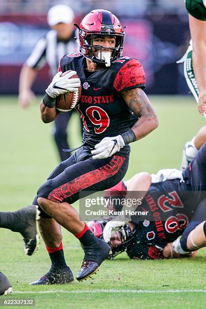 Donnel Pumphrey of the San Diego State Aztecs runs with the ball in the first half against the Hawaii Rainbows in Qualcomm Stadium on November 5,...