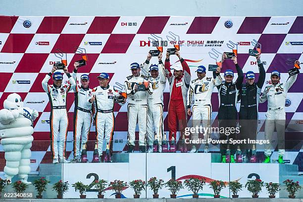 October 30: Ferrari 488 GT3' drivers Narsat Muzayyin, Rui Aguas and Marco Cioci celebrate the victory of GT Class during the 2016-2017 Asian Le Mans...