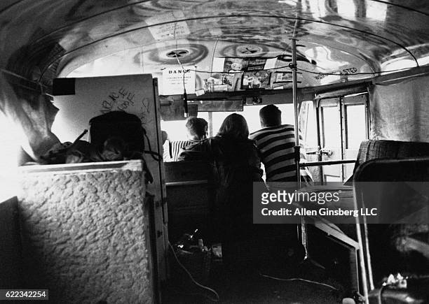 Merry Pranksters Neal Cassady and Ken Babbs ride in Ken Kesey's bus Further with a friend on the way to Timothy Leary's Castalia Foundation in...