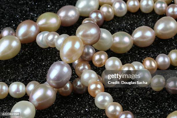 pearl necklace - silver spoon in mouth stock pictures, royalty-free photos & images