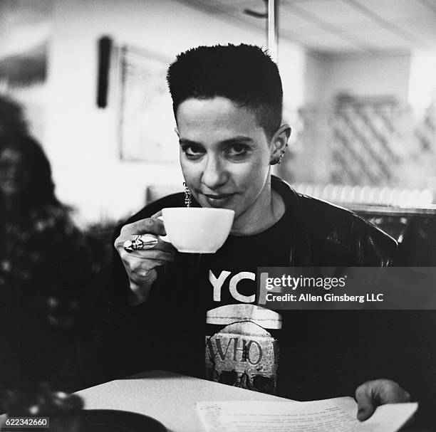 Kathy Acker Taking Sip from Cup