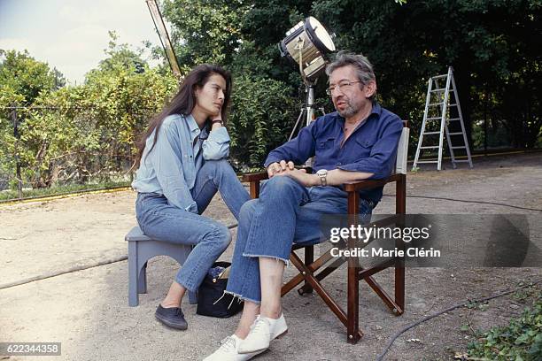 French singer, songwriter, screenwriter, actor and director Serge Gainsbourg and his partner Eurasian singer and model Bambou, on the set of his film...