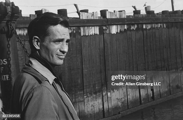 Jack Kerouac waits for a ferry at a dock in Staten Island.