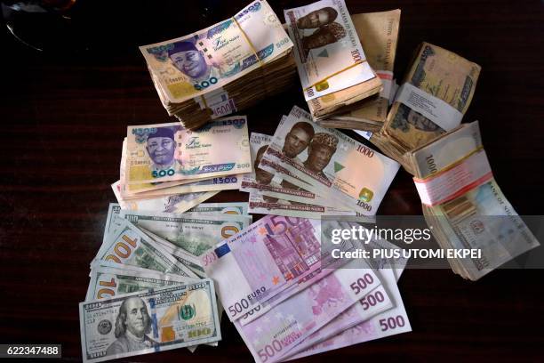 Bank notes in naira, dollars, euros and pounds sterling are pictured in Lagos, on January 26, 2016.