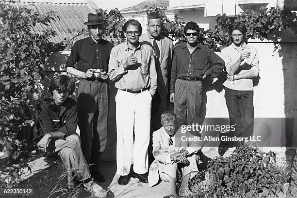 Sitting in front are Peter Orlovsky and Paul Bowles, behind them stand William Burroughs, Allen Ginsberg, Alan Ansen, Gregory Corso and Ian...