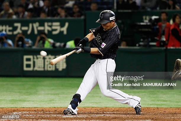 Outfielder Akira Nakamura of Japan hits a two-run homer from Pitcher Sergio Romo of Mexico in the ninth inning during the international friendly...