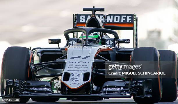 Sahara Force India F1 Team German driver Nico Hulkenberg tests the so-called halo cockpit protection device during first practice session of the...