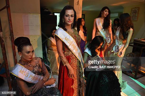 Miss transvestite Indonesia 2016 contestants wait to perform during the 2016 Miss Queen contest in Jakarta on November 11, 2016. Indonesian...