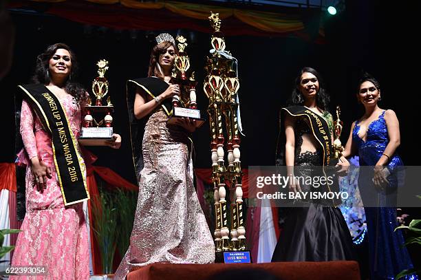 Miss Transvestite Indonesia 2016 Qie Nabh Tappii from Jakarta, runner up 1 and 2 Sefty Castanyo and Amanda Sandova , pose during the 2016 Miss Queen...