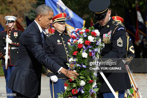 President Barack Obama participates in a wreath-laying ceremony at the Tomb of the Unknown Soldier at Arlington National Cemetery in Arlington,...