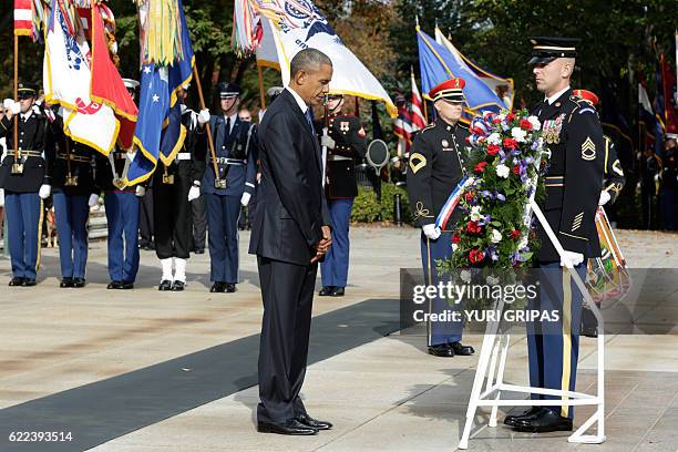 President Barack Obama participates in a wreath-laying ceremony at the Tomb of the Unknown Soldier at Arlington National Cemetery in Arlington,...