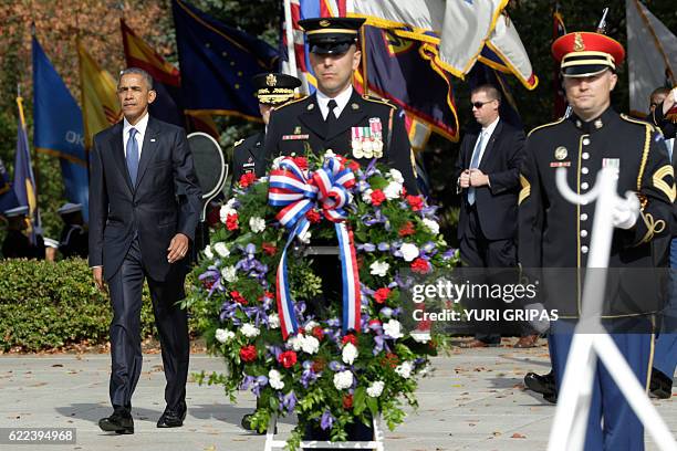 President Barack Obama participates in a wreath-laying ceremony at the Tomb of the Unknown Soldier at Arlington National Cemetery in Arlington,...