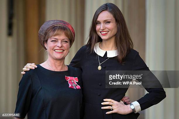 Former Blue Peter presenter Janet Ellis with her daughter Sophie Ellis Bextor after receiving her MBE from the Duke of Cambridge at Buckingham Palace...