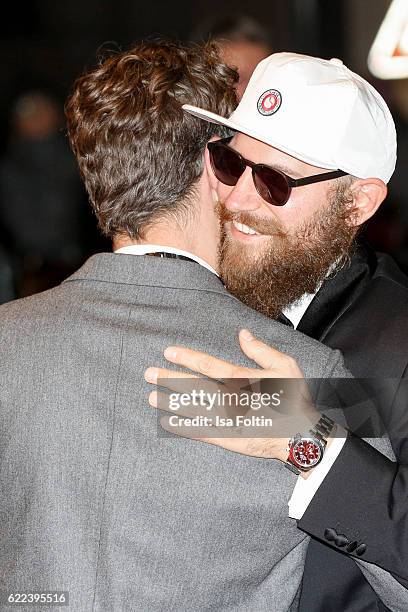 Model Simon Lohmeyer and musician MC Fitti attend the GQ Men of the year Award 2016 at Komische Oper on November 10, 2016 in Berlin, Germany.