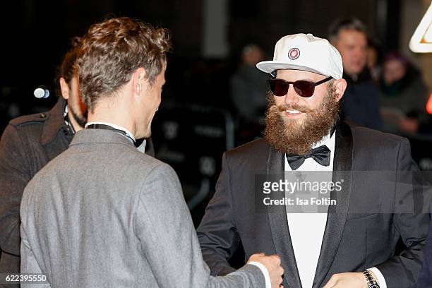 Model Simon Lohmeyer and musician MC Fitti attend the GQ Men of the year Award 2016 at Komische Oper on November 10, 2016 in Berlin, Germany.
