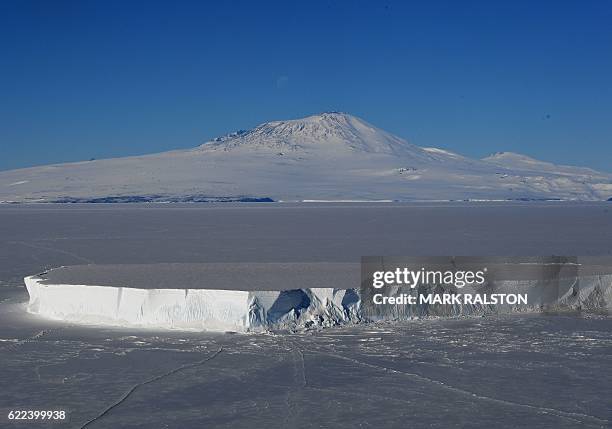 An iceberg lies in the Ross Sea with Mount Erebus in the background near McMurdo Station, Antarctica on November 11, 2016. US Secretary of State John...